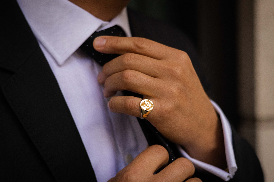 Man wearing Oxford Oval Gold Signet ring by Hancocks